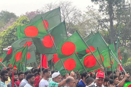 People from all walks of life celebrate Bangladesh's Independence and National Day. People are seen marching at savar mausoleum carrying the national flag -- Photo by Nazrul Islam
