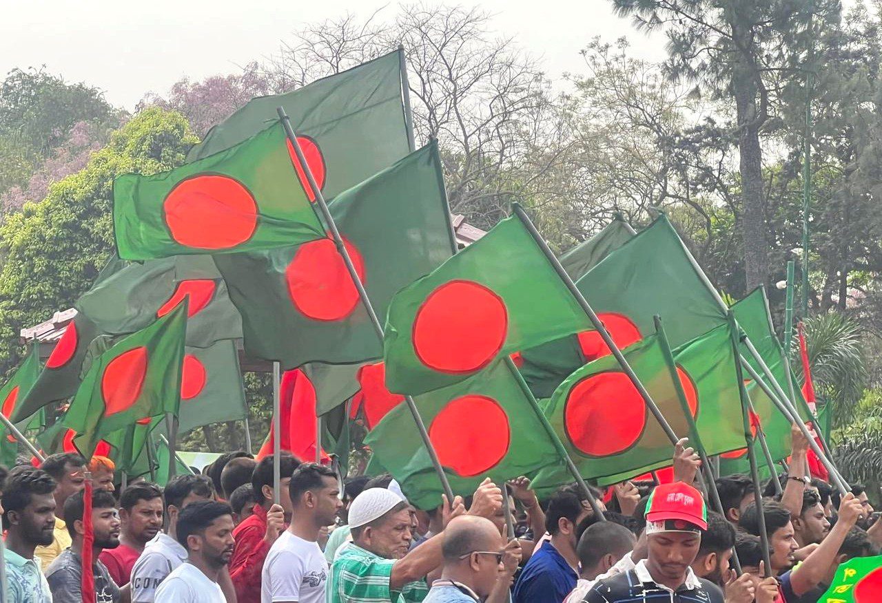 People from all walks of life celebrate Bangladesh's Independence and National Day. People are seen marching at savar mausoleum carrying the national flag -- Photo by Nazrul Islam