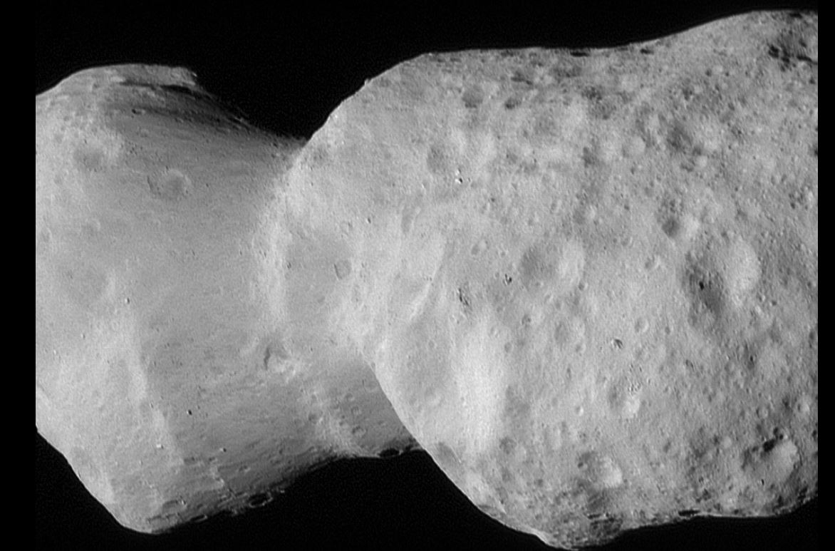 NASA’s Lucy spacecraft beams back pictures of an asteroid shaped like a lumpy bowling pin