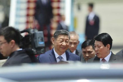 Chinese President Xi Jinping, center, speaks with Vietnam's President Luong Cuong, as he arrives for a two-day state visit, at Hanoi's Noi Bai International Airport, Vietnam on Monday, April 14, 2025. Pool Photo via AP