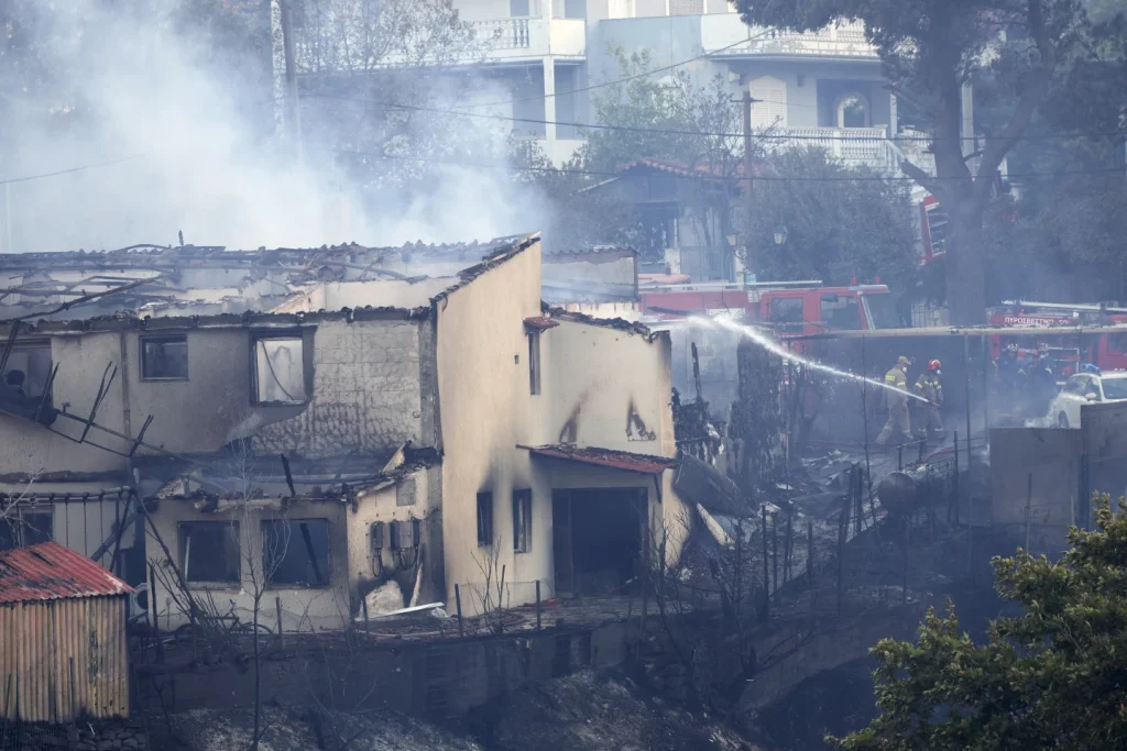Wildfire rips through Athens suburb Kryoneri, forcing evacuations as homes burn
