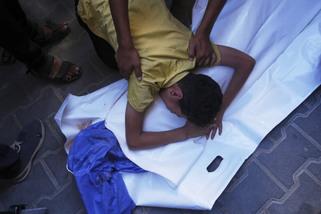 Israeli strikes kill at least 32 in Gaza, including six children at a water collection point
