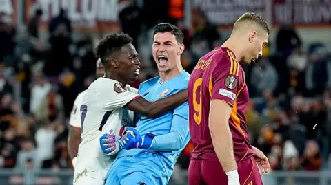 Lille goalkeeper Ozer saves three penalties to stun Roma