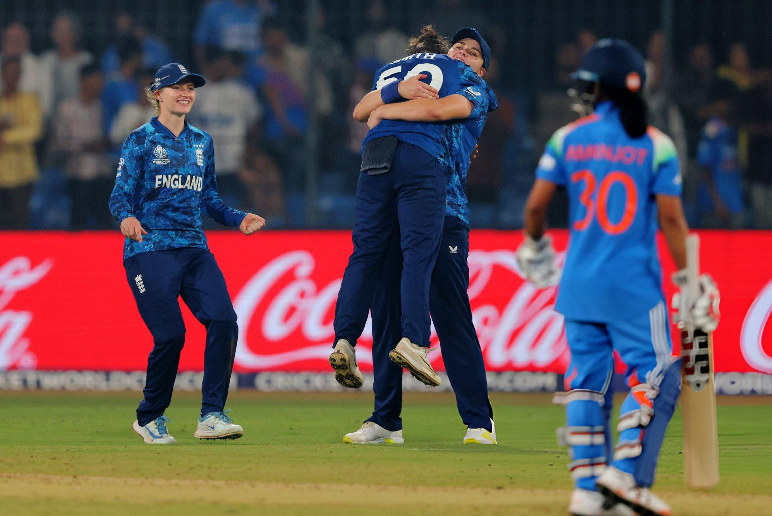 England survive late scare to seal semi-final spot against India