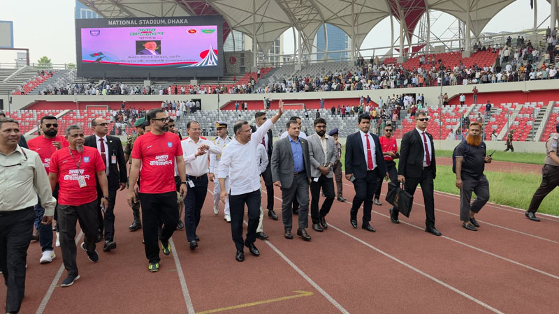 Prime Minister Tarique Rahman, his daughter Zaima Rahman along with the State Minister for Youth and Sports Aminul Haque during a friendly match between former footballers at Dhaka National Stadium on Thursday. Photo: PMO