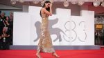 Kendall Jenner stuns in understated gold Armani gown at Venice