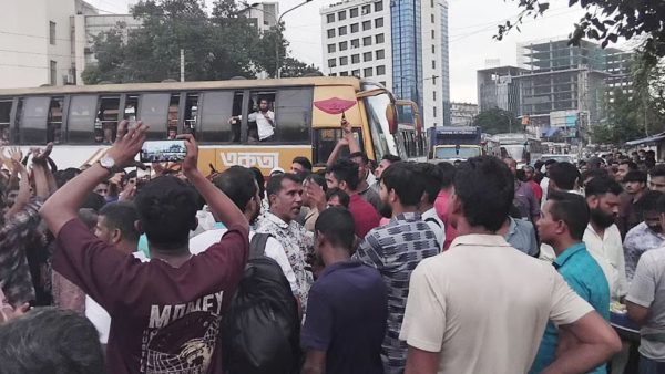 Stand-off at Mohakhali: Transport workers block road over bus impounds, fines