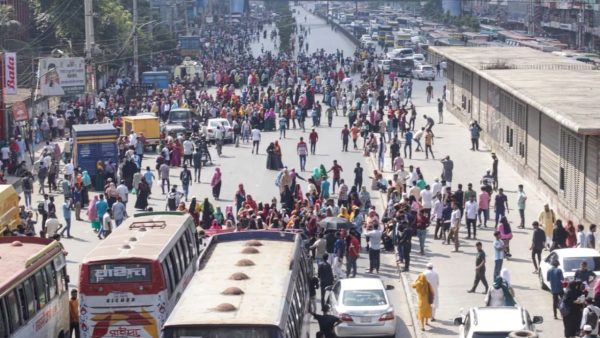 Police use tear gas, water cannons as workers clash in Uttara